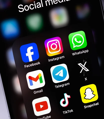 Phone screen displaying popular social media icons such as Facebook, Instagram, Twitter, and LinkedIn, representing digital communication, online presence, and social networking platforms