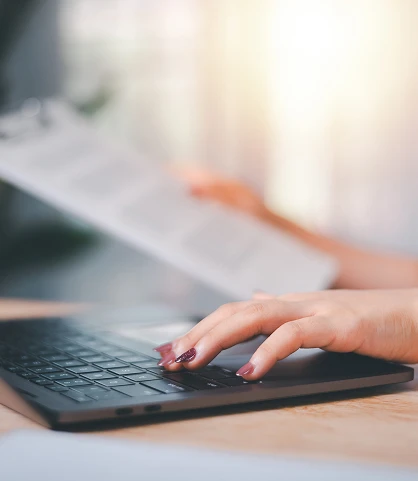 hands typing on a keyboard